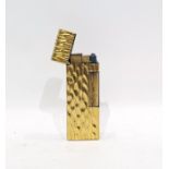 Dunhill gold-coloured bark-effect metal and burgundy enamel lighter, impressed marks to base, US