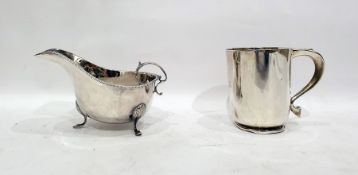 Silver mug by S Blanckensee & Son Ltd, Chester 1931, of plain tapering form and a silver cream jug