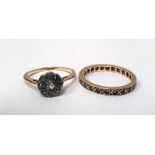 LOT WITHDRAWN Gold nine-stone daisy flowerhead ring marked 18ct and a gold eternity ring marked