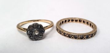 LOT WITHDRAWN Gold nine-stone daisy flowerhead ring marked 18ct and a gold eternity ring marked