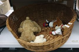 Wicker dog basket and various soft toys