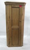 Old pine standing corner cupboard, the fielded panel door enclosing three shelves, width 67cm x