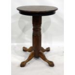 An oak high bar table with circular top, on substantial pedestal support with splay legs, diameter