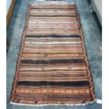 Eastern striped floor rug in peaches, oranges, brown and creams, 242cm x 122cm
