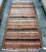 Eastern striped floor rug in peaches, oranges, brown and creams, 242cm x 122cm