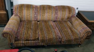 George Smith three-seat sofa in the manner of Howard, vibrantly upholstered, raised upon turned