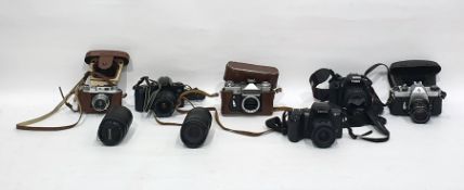 Box of assorted cameras to include examples by Canon