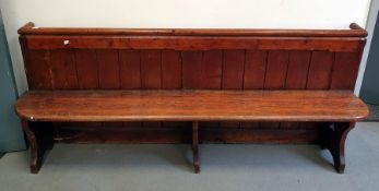 Victorian stained pine pew with panel back and solid seat, length 203cms