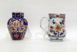 18th century Chinese export porcelain mug decorated with red flowers on blue leaves, gilt highlights