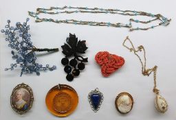 Quantity of costume jewellery including a horn brooch in the form of a bunch of grapes, a painted