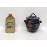 Studio pottery stoneware lidded pot of ovoid form, brown ground with lighter swirl decoration,