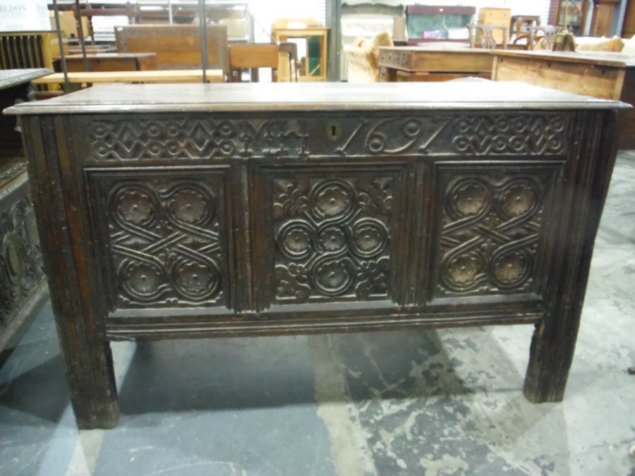 17th century oak coffer, the rectangular top with moulded edge, above the carved front emblazed with - Image 2 of 7