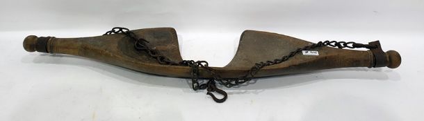 Old wooden yoke with chain