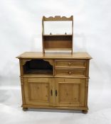 Contemporary pine cupboard with moulded edged top, open shelf, two short drawers with cupboards