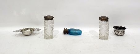 Victorian scent bottle with blue glass body of oval form, the unmarked white metal cover with