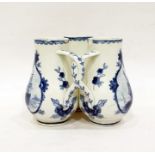 Delft fuddling cup with three beakers, of baluster form with interlocking handles, underglaze blue