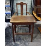 Early 20th century oak carver chair with roundel motif to the top rail, with upholstered seat and