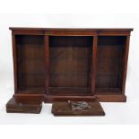 Victorian mahogany breakfront open bookcase with adjustable shelves, raised on a plinth base,
