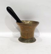 Antique brass flared-rim pestle and iron mortar