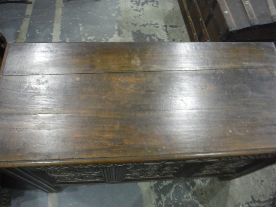 17th century oak coffer, the rectangular top with moulded edge, above the carved front emblazed with - Image 3 of 7