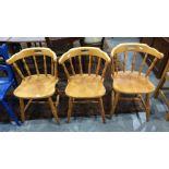 Set of three 20th century spindleback dining chairs on turned supports and stretchered bases (3)