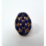 Gold cluster ring set with lapis lazuli (possibly Indian), the shoulders set with rubies (one