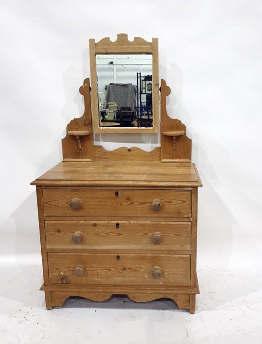 Victorian pine mirror-back chest of three long drawers, with trinket shelves, raised on bracket