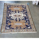 Eastern Sumak rug decorated on a midnight blue ground with three central lozenges and decorated with