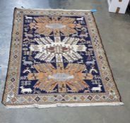 Eastern Sumak rug decorated on a midnight blue ground with three central lozenges and decorated with