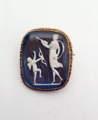 Gold-coloured metal and iridescent ground cameo style brooch, rounded oblong, with Cupid and Psyche,
