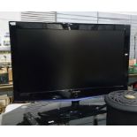 Samsung flatscreen television, 40" screen with remote control on smoked glass television stand
