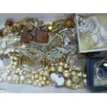 Quantity of costume jewellery including faux pearls, brooches, a fitted faux suede jewellery box