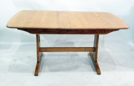 20th century light elm Ercol extending dining table on end pillar supports united by stretcher