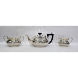 Silver three-piece tea set by Henry Matthews, Birmingham 1927, comprising teapot, two-handled