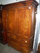 19th century mahogany linen press, the two doors enclosing linen drawers, upon a base of two short