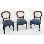 Set of six Victorian mahogany balloon-back dining chairs with plush overstuffed seats above the