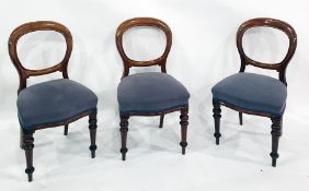 Set of six Victorian mahogany balloon-back dining chairs with plush overstuffed seats above the