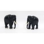 Pair of 20th century carved ebony Indian elephants, with bone tusks and toes, 15 cm tall