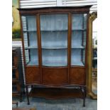 Edwardian mahogany satinwood inlaid serpentine-front glazed display cabinet with three shelves and