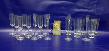 Set of eight champagne flute glasses, large hi-ball glasses, set of four glass candlesticks and an