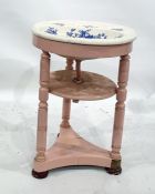 Porcelain wash basin on a pink painted stand, the circular middle tier united by turned supports, on