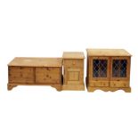 Pine bedside cupboard with single drawer above cupboard door, to plinth base, a pine audio