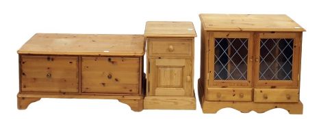 Pine bedside cupboard with single drawer above cupboard door, to plinth base, a pine audio