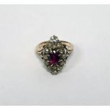 Diamond and ruby marquise ring set centre oval facet-cut ruby having surround of 14 variously
