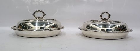 Pair of lidded entree dishes with beaded borders and removable handles to create four dishes