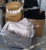 Pair of bed quilts, various curtains and a wicker laundry basket