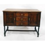 Early 20th century oak sideboard with moulded edge, above three central drawers flanked by
