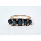 9ct gold five-stone sapphire ring, the graduated oval mix cut sapphires with diamond points, ring