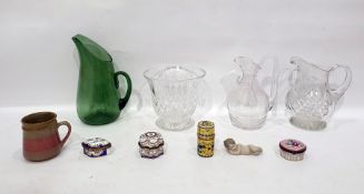 Three glass water jugs, a glass vase, a quantity of patch pots, a mug and a Lladro putti