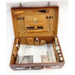 S Fisher Ltd of London brown leather fitted travel dressing case, the lid emblazoned with the
